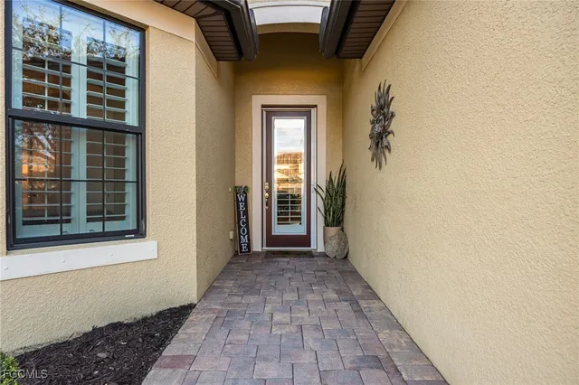 a view of a front door of a house with a window