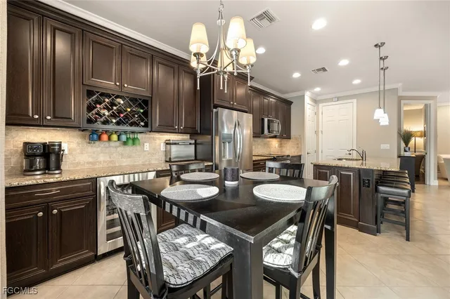 a kitchen with kitchen island granite countertop wooden cabinets and a center island