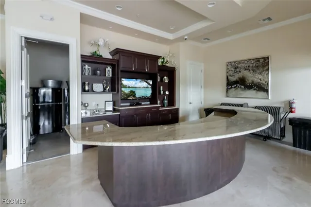 an aerial view of a houses with a lake