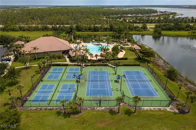 an aerial view of a house with a lake view