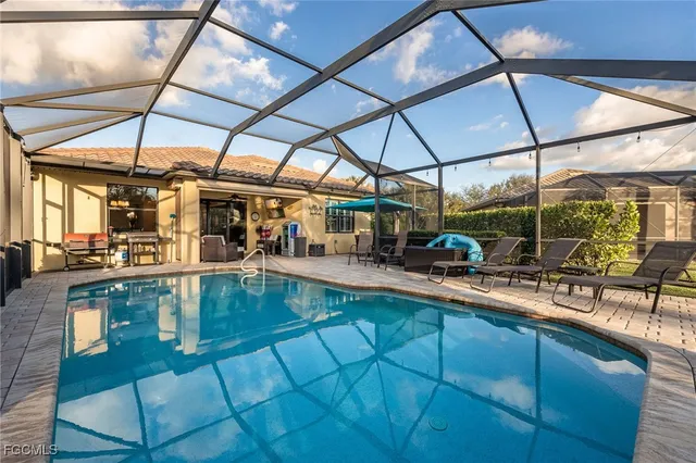 a view of a swimming pool with sitting area