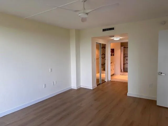 a kitchen with stainless steel appliances granite countertop a sink and a refrigerator