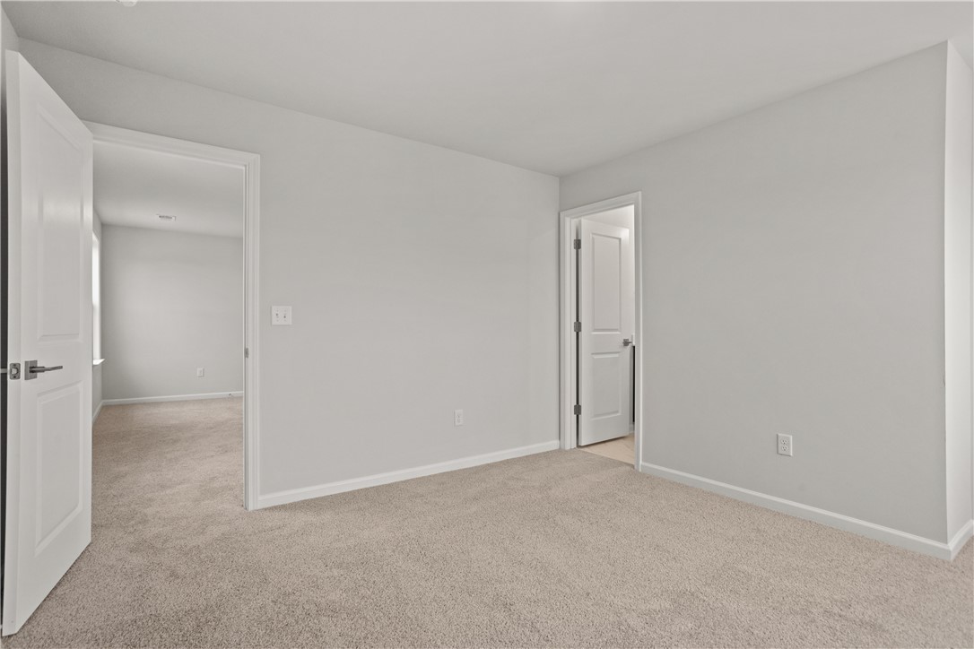 629 Sweetspire Trail, Unit 149 Seneca, SC 29678 - Photo 14 of 30 A spacious, naturally illuminated room featuring plush carpet and crisp white walls.