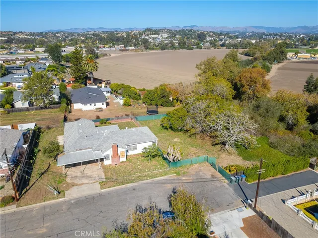 an aerial view of lake and residential houses with outdoor space
