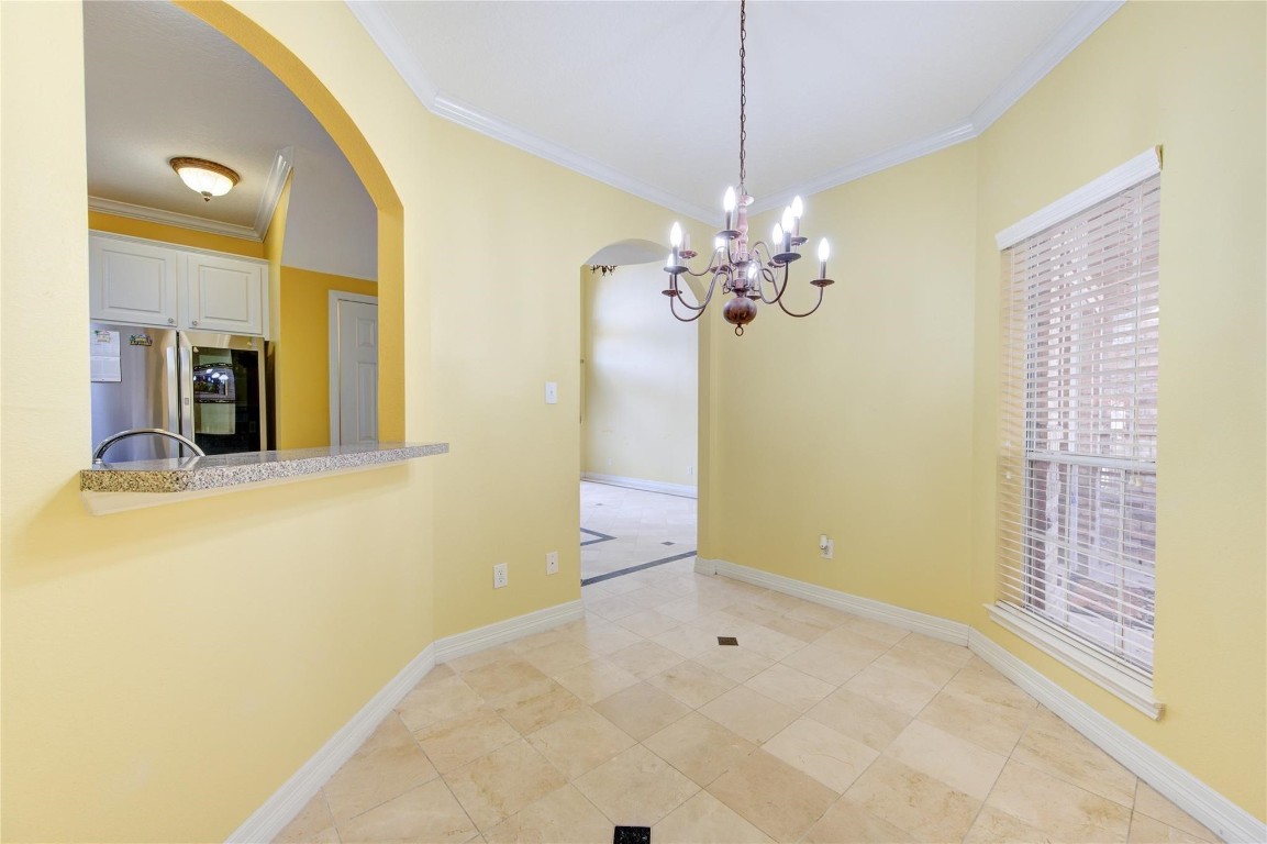 14420 Walters Road, Unit 58 Houston, TX 77014 - Photo 12 of 25 a view of a hallway with chandelier