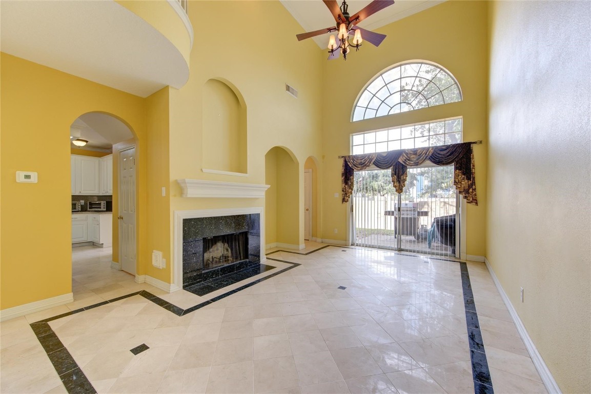 14420 Walters Road, Unit 58 Houston, TX 77014 - Photo 5 of 25 a view of an empty room with a fireplace