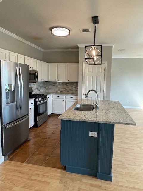 7501 Shadowridge Run, Unit 135 Austin, TX 78749 - Photo 6 of 23 a kitchen with stainless steel appliances granite countertop a sink stove and refrigerator