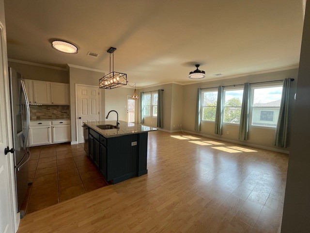 7501 Shadowridge Run, Unit 135 Austin, TX 78749 - Photo 9 of 23 a large kitchen with sink and cabinets