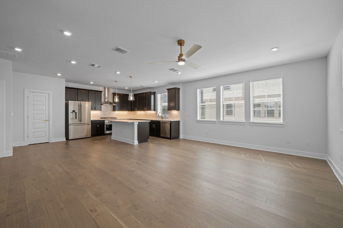 6312 Stockman Drive, Unit 5 Austin, TX 78747 - Photo 15 of 40 a view of a kitchen with a stove cabinets and a kitchen