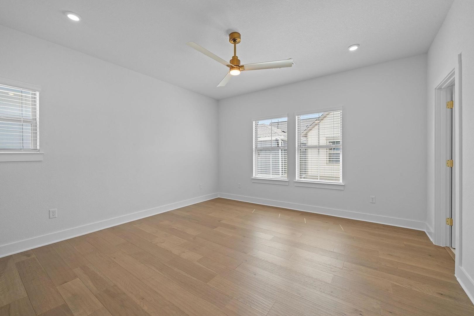 6312 Stockman Drive, Unit 5 Austin, TX 78747 - Photo 16 of 40 an empty room with ceiling fan and window