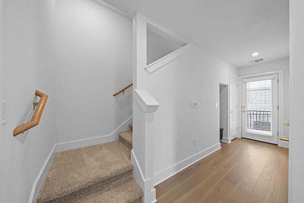 6312 Stockman Drive, Unit 5 Austin, TX 78747 - Photo 18 of 40 an entryway of a house with wooden floor and windows