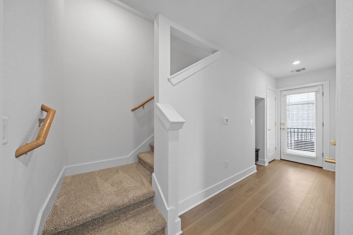 6312 Stockman Drive, Unit 5 Austin, TX 78747 - Photo 20 of 40 an entryway of a house with wooden floor and windows