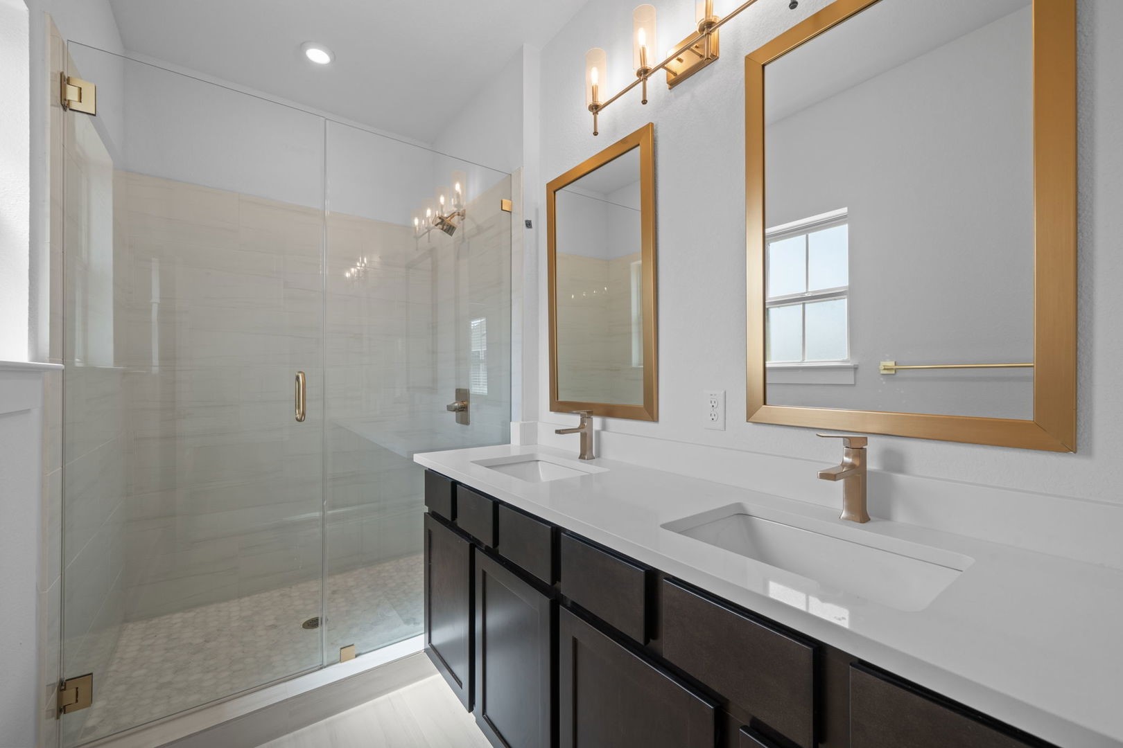 6312 Stockman Drive, Unit 5 Austin, TX 78747 - Photo 33 of 40 a bathroom with double sink and a mirror