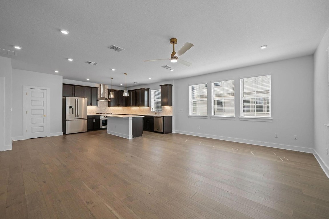 6312 Stockman Drive, Unit 5 Austin, TX 78747 - Photo 9 of 40 a view of a kitchen with a stove cabinets and a kitchen