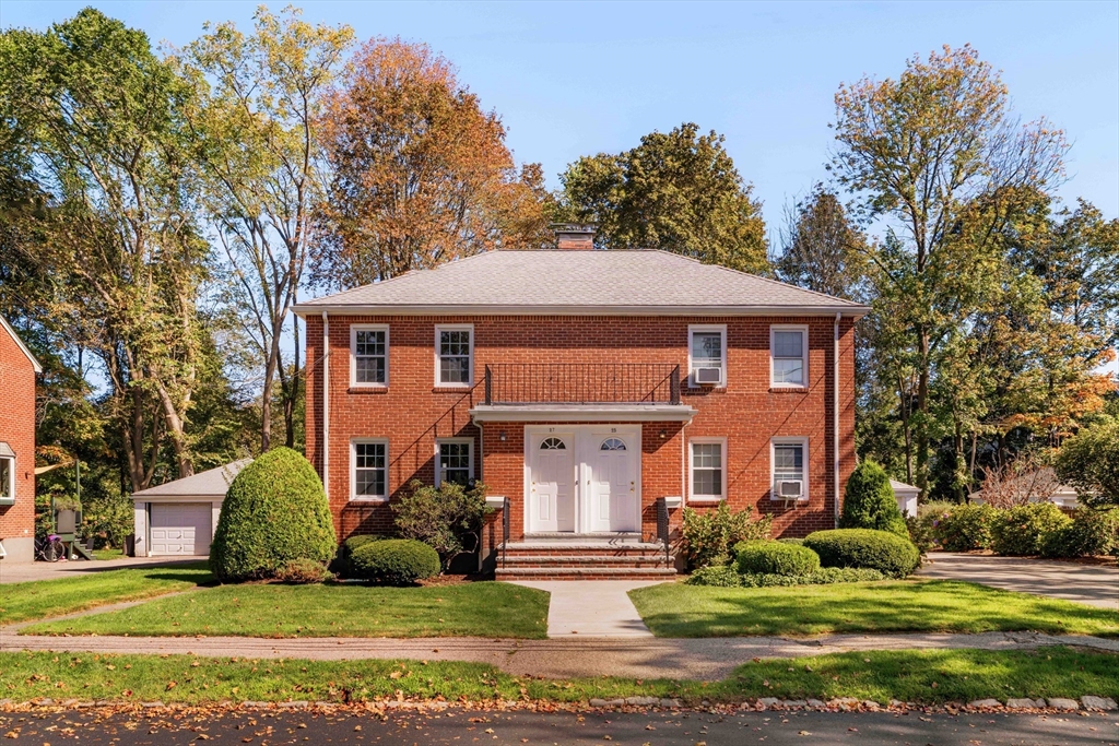 27 Payne Road, Unit 1 Newton, MA 02461 - Photo 1 of 18 a front view of a house with a yard