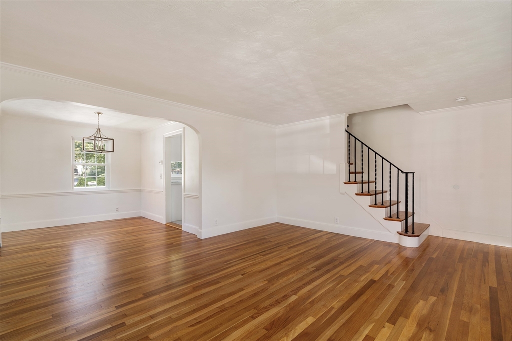 27 Payne Road, Unit 1 Newton, MA 02461 - Photo 8 of 18 a view of an empty room with wooden floor and a window