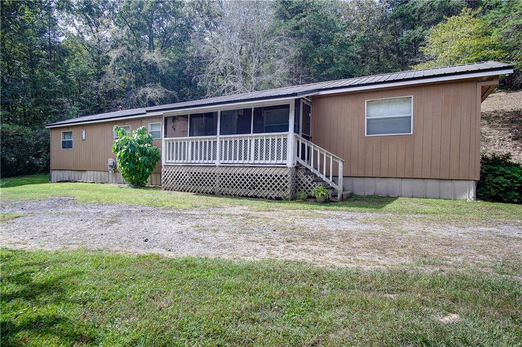 1009 Hightower Loop Ranger, GA 30734 - Photo 1 of 1 a front view of a house with garden