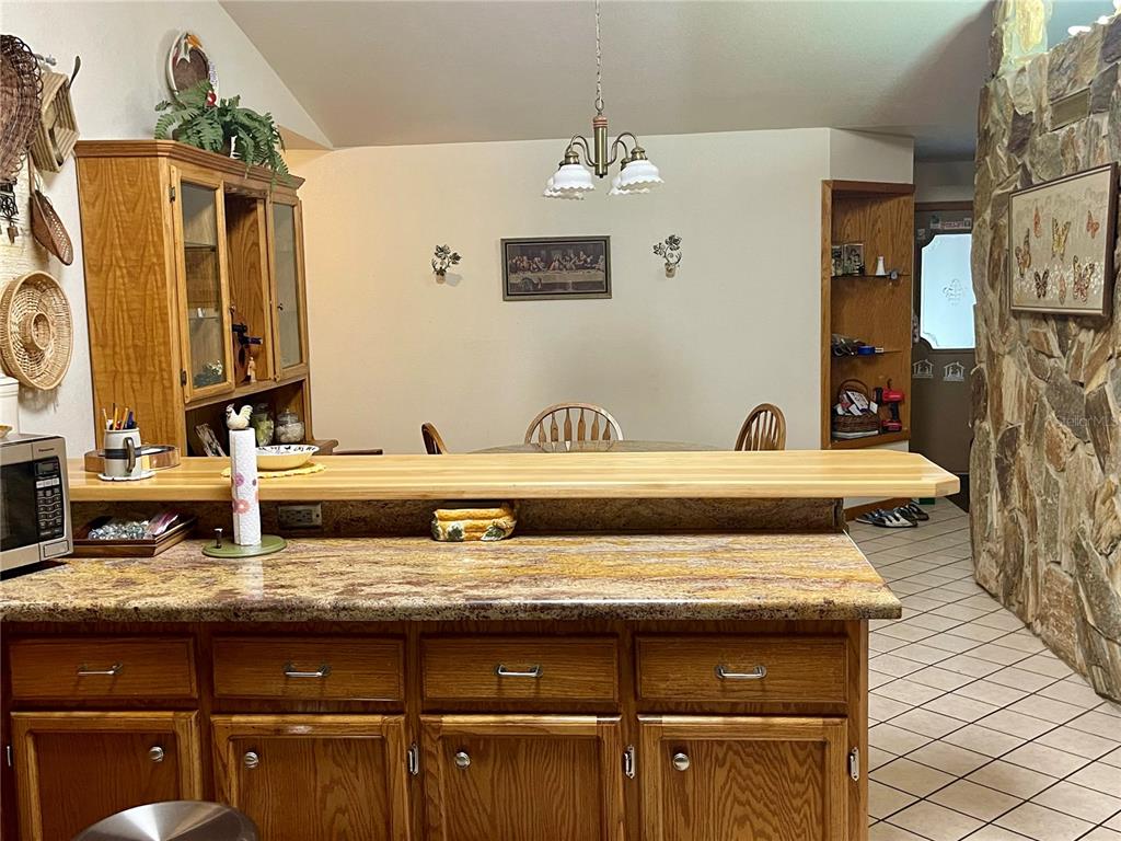Undisclosed Address Reddick, FL 32686 - Photo 12 of 43 a bathroom with a granite countertop sink and a mirror