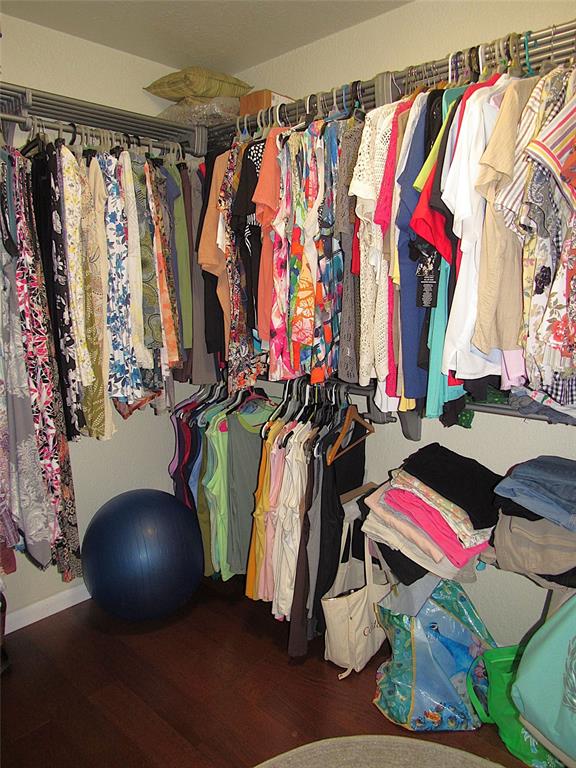 Undisclosed Address Reddick, FL 32686 - Photo 18 of 43 a view of walk in closet with clothes and shoes