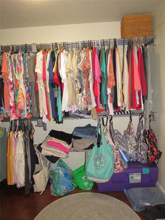 Undisclosed Address Reddick, FL 32686 - Photo 19 of 43 a view of walk in closet with clothes