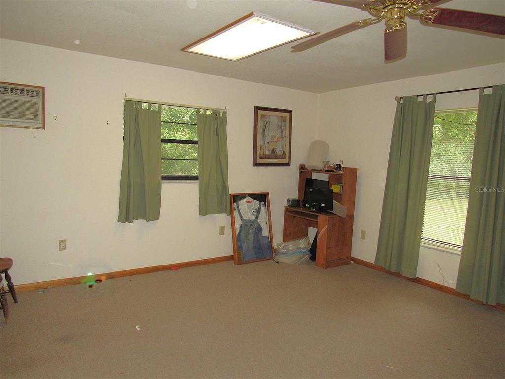 Undisclosed Address Reddick, FL 32686 - Photo 26 of 43 a room with air conditioner and a window