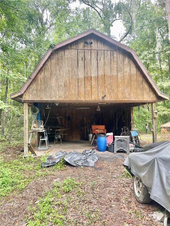 Undisclosed Address Reddick, FL 32686 - Photo 34 of 43 a backyard of a house with yard and outdoor seating