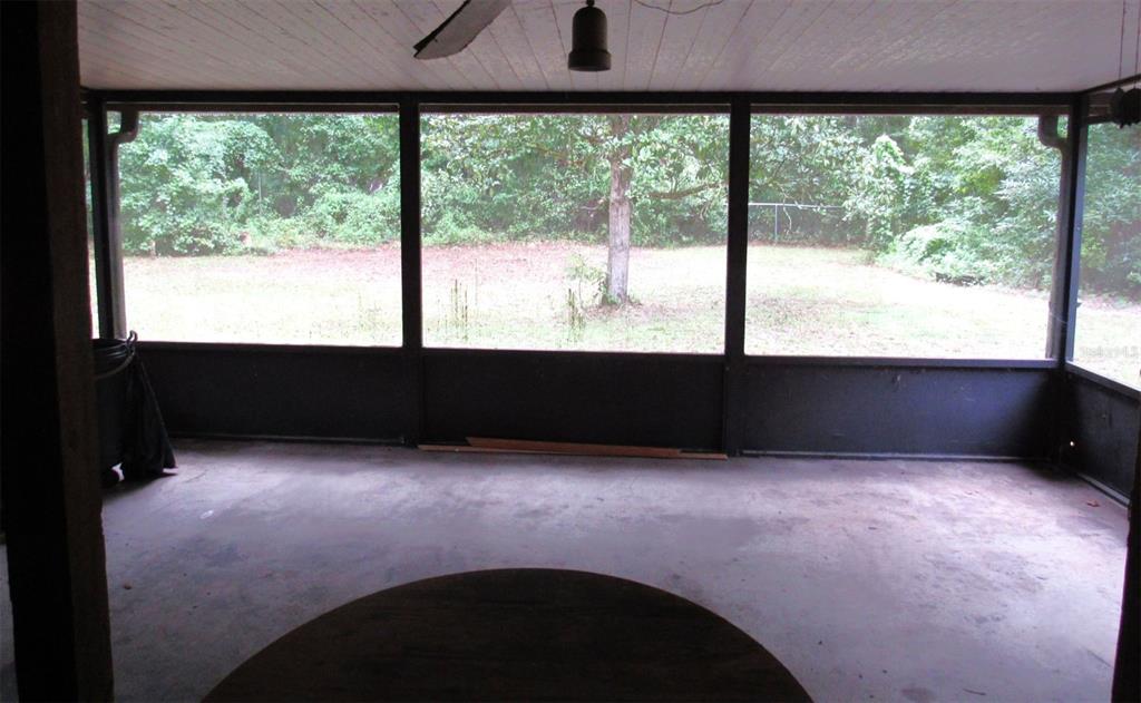 Undisclosed Address Reddick, FL 32686 - Photo 41 of 43 an empty room with large windows