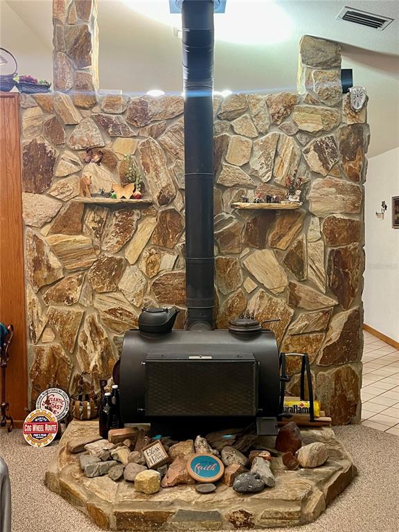 Undisclosed Address Reddick, FL 32686 - Photo 7 of 43 a living room with a couch and a table