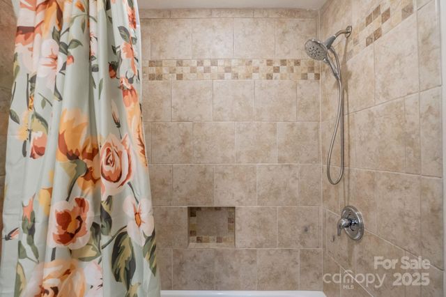 a bathroom with a shower curtain