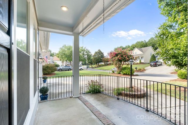 a view of a porch with a floor to ceiling window