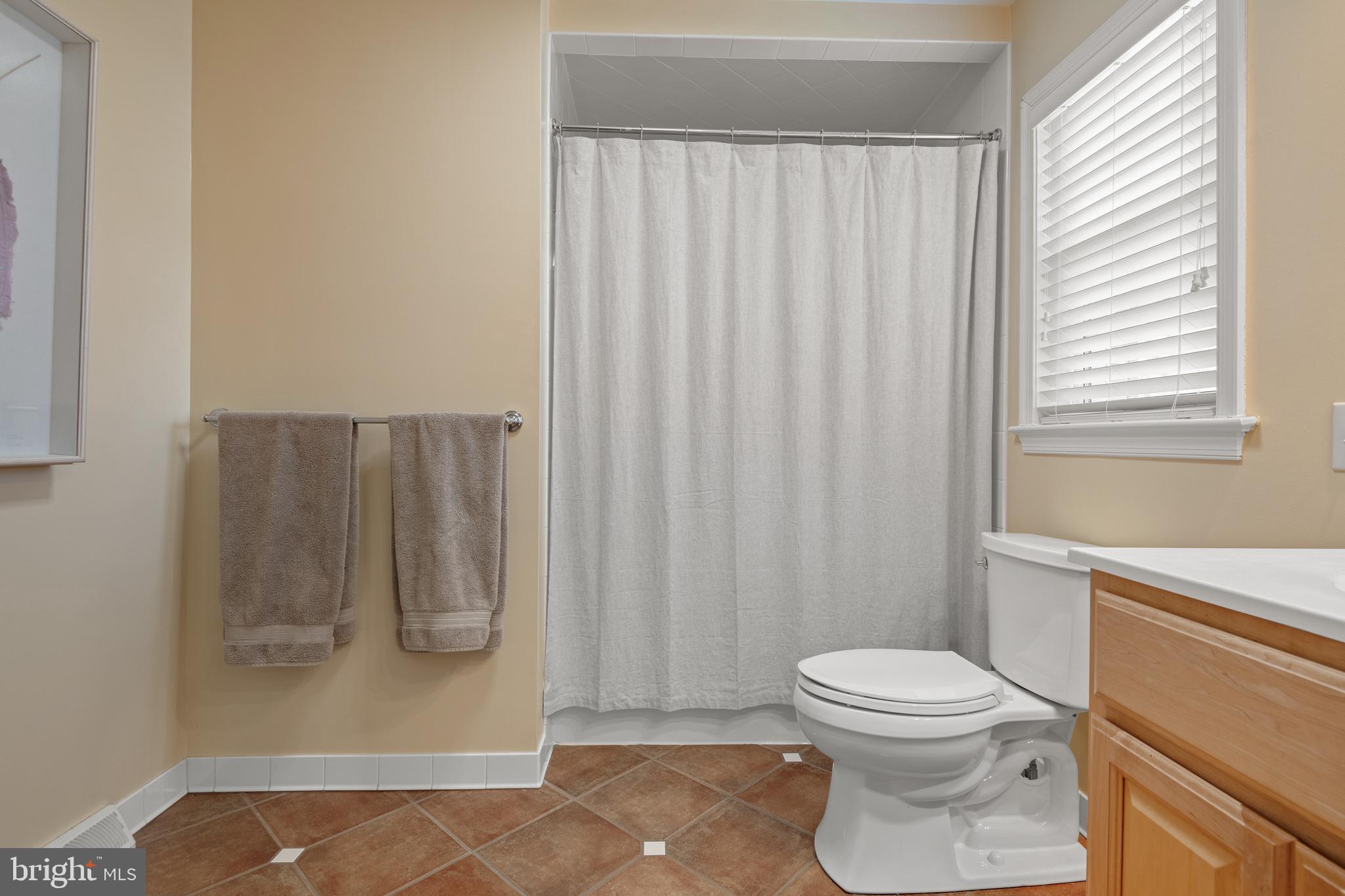 2705 Spring Valley Road Lancaster, PA 17601 - Photo 31 of 60 a white toilet sitting next to a bathroom sink