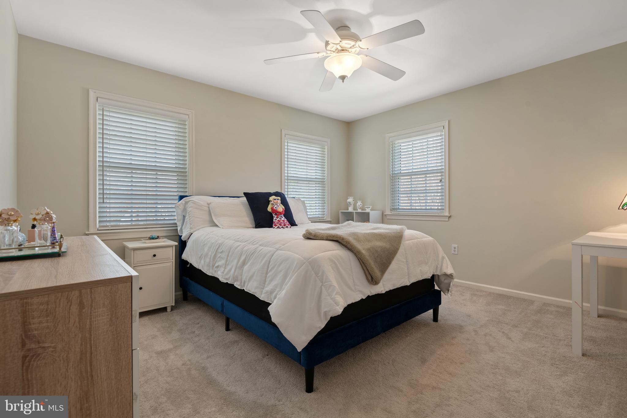 2705 Spring Valley Road Lancaster, PA 17601 - Photo 32 of 60 a spacious bedroom with a bed and a table in it