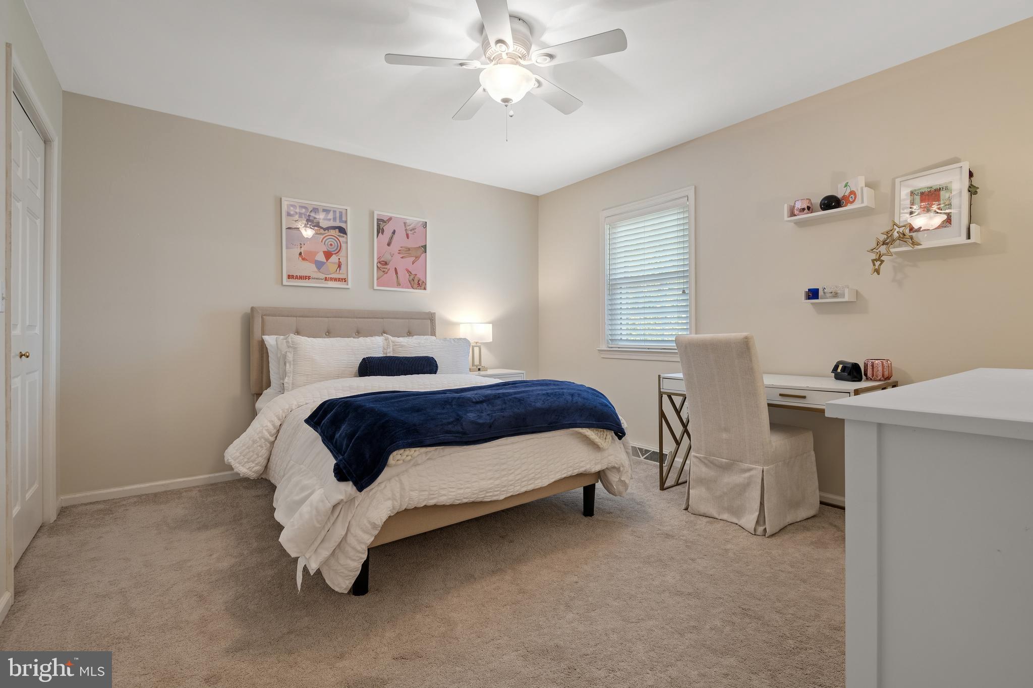 2705 Spring Valley Road Lancaster, PA 17601 - Photo 34 of 60 a bedroom with a bed and a chandelier