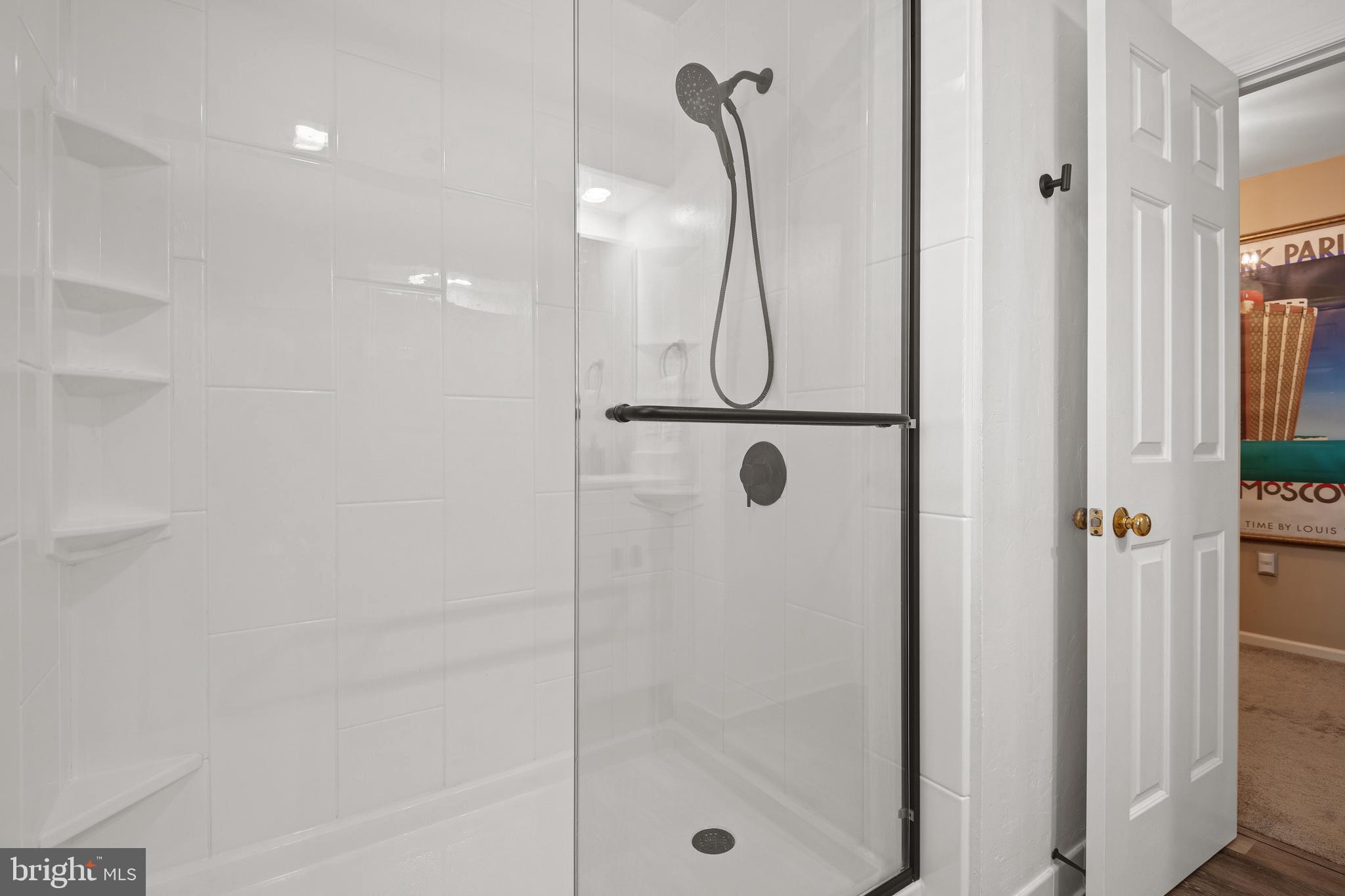 2705 Spring Valley Road Lancaster, PA 17601 - Photo 37 of 60 a bathroom with a glass shower door