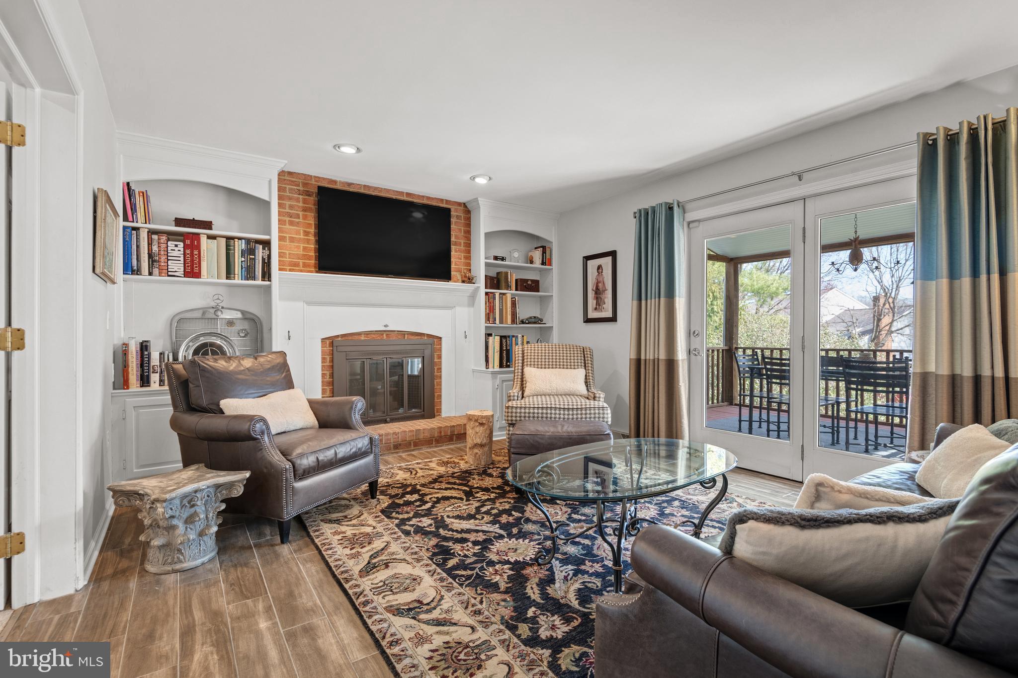 2705 Spring Valley Road Lancaster, PA 17601 - Photo 4 of 60 a living room with furniture fireplace and a flat screen tv