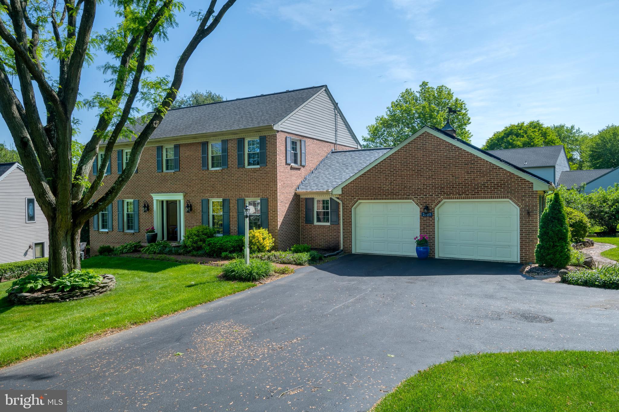 2705 Spring Valley Road Lancaster, PA 17601 - Photo 45 of 60 a front view of a house with a yard and garage