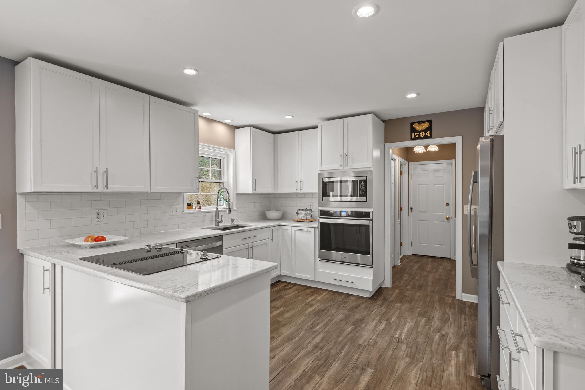 2705 Spring Valley Road Lancaster, PA 17601 - Photo 6 of 60 a kitchen with stainless steel appliances a refrigerator sink and cabinets
