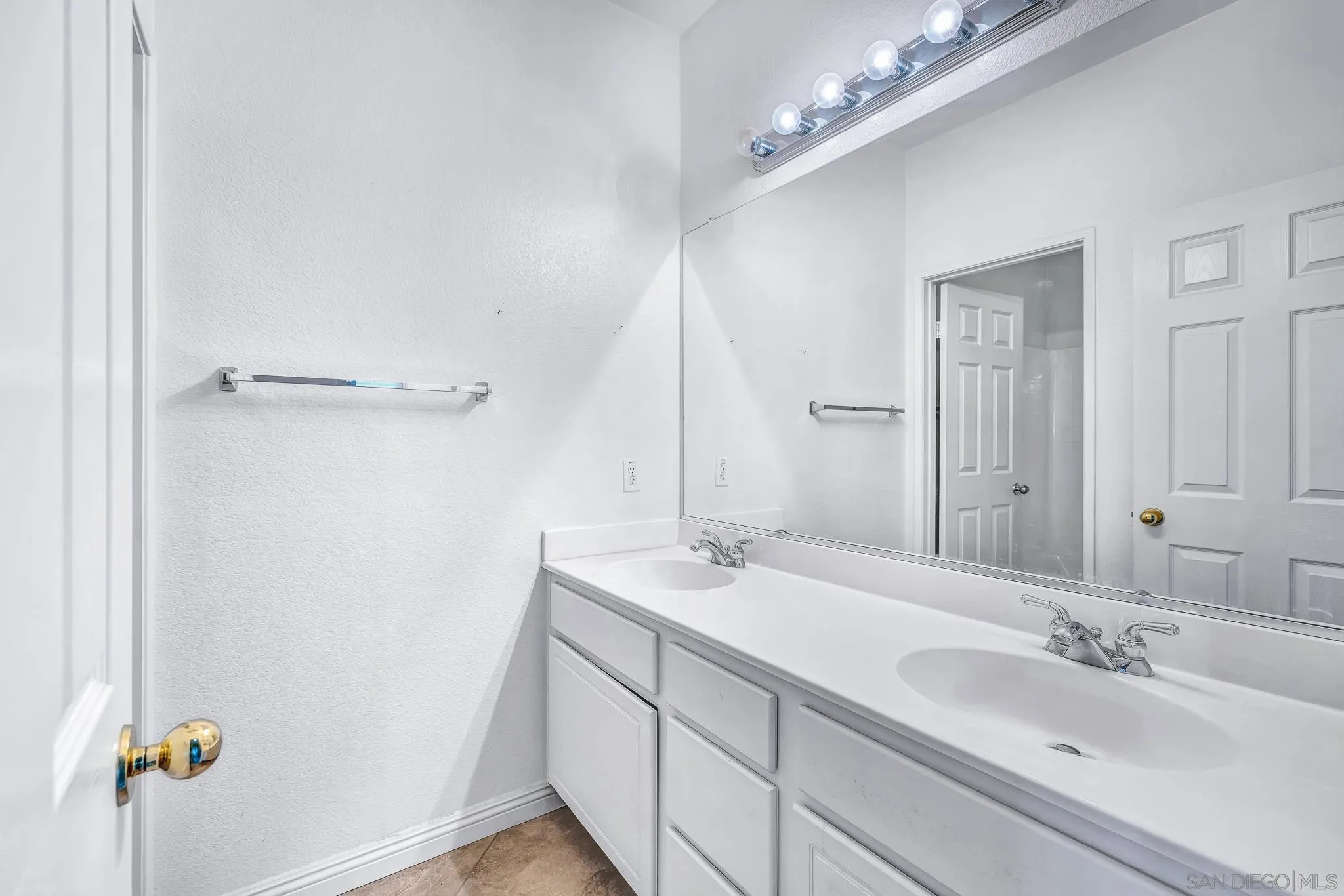 35511 Shadow Drive Winchester, CA 92596 - Photo 12 of 34 a bathroom with a sink double vanity granite and a mirror