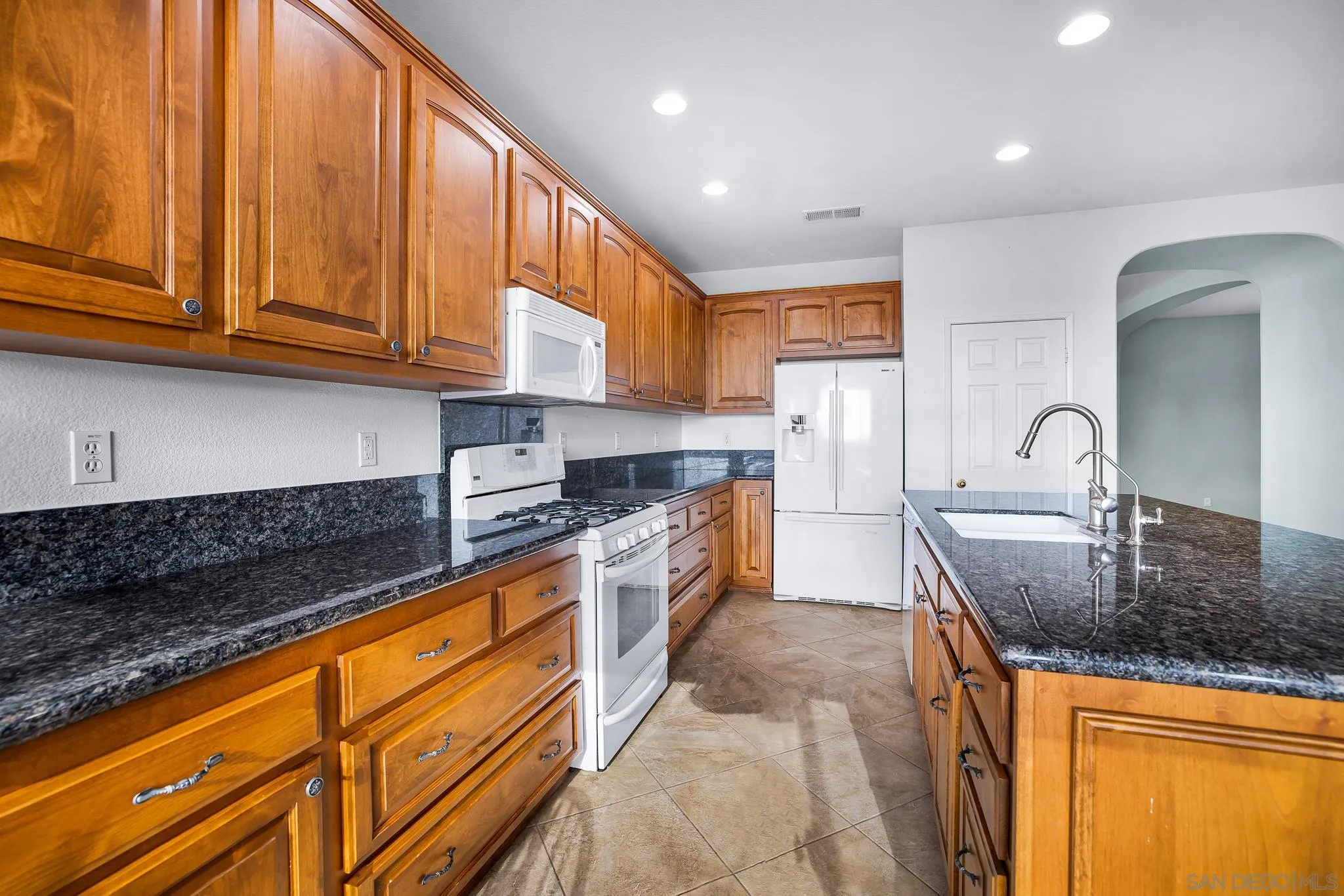 35511 Shadow Drive Winchester, CA 92596 - Photo 17 of 34 a kitchen with stainless steel appliances granite countertop a sink stove and cabinets
