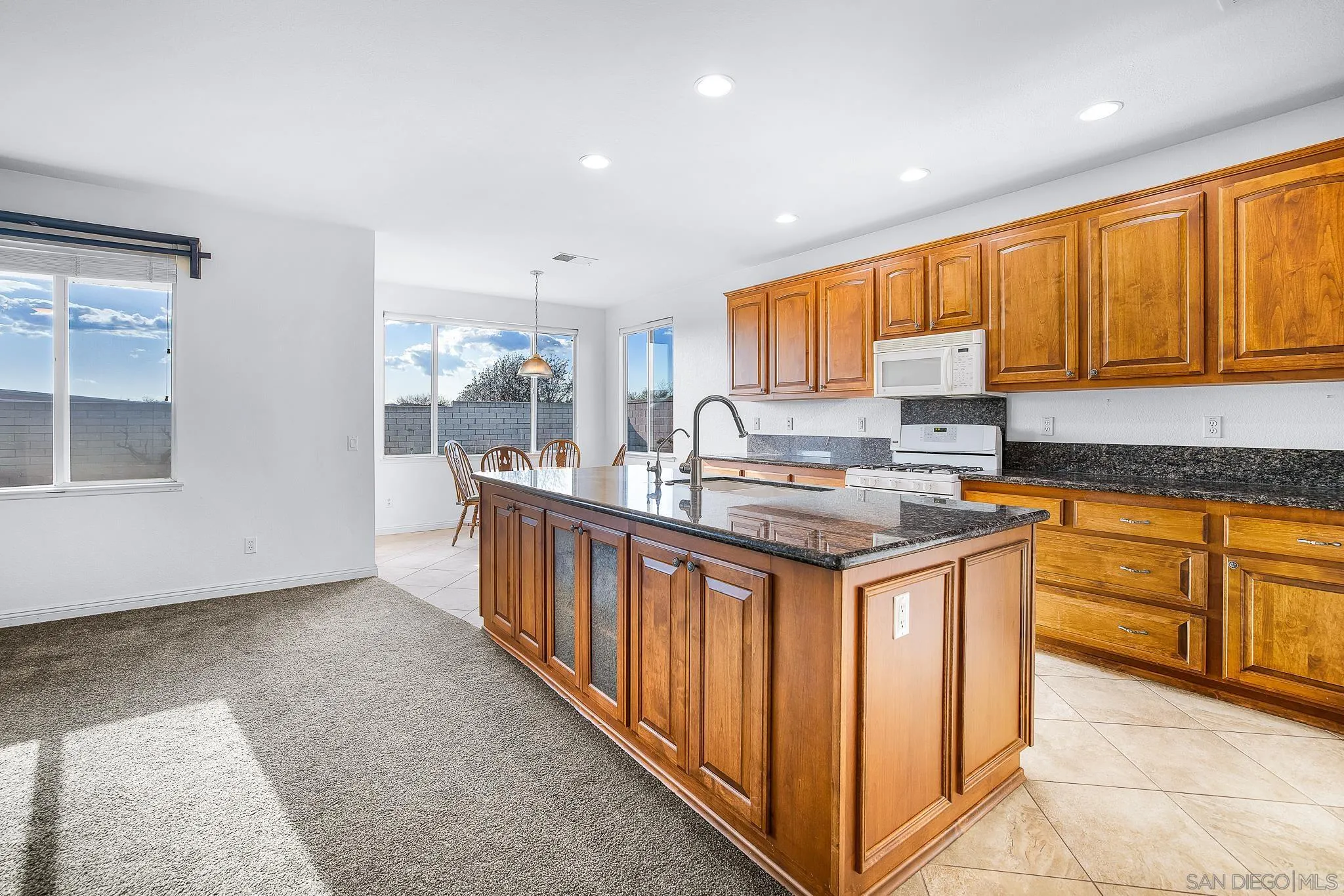35511 Shadow Drive Winchester, CA 92596 - Photo 18 of 34 a kitchen with stainless steel appliances granite countertop a stove a sink and a refrigerator