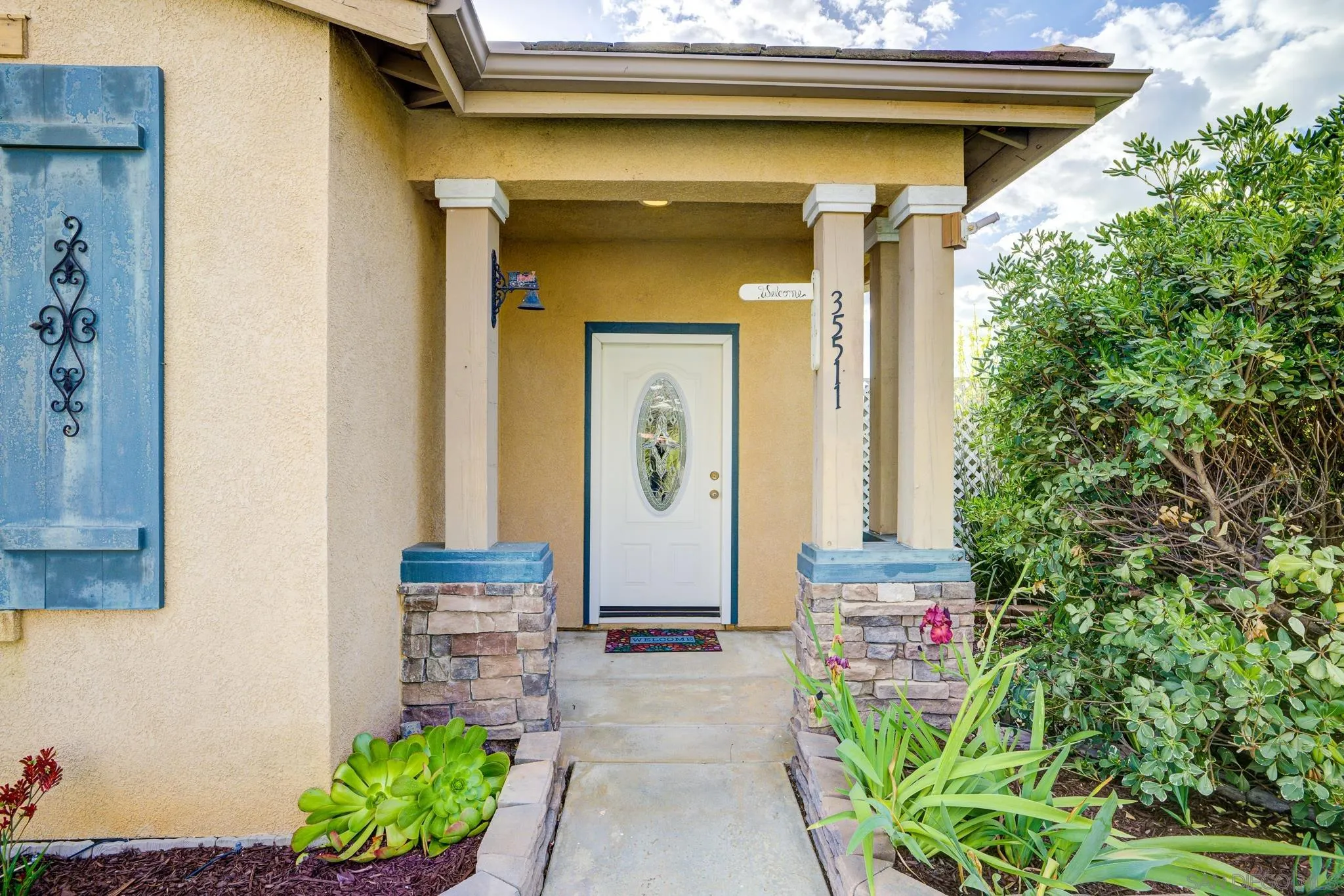 35511 Shadow Drive Winchester, CA 92596 - Photo 2 of 34 a front view of a house with a lots of potted plants
