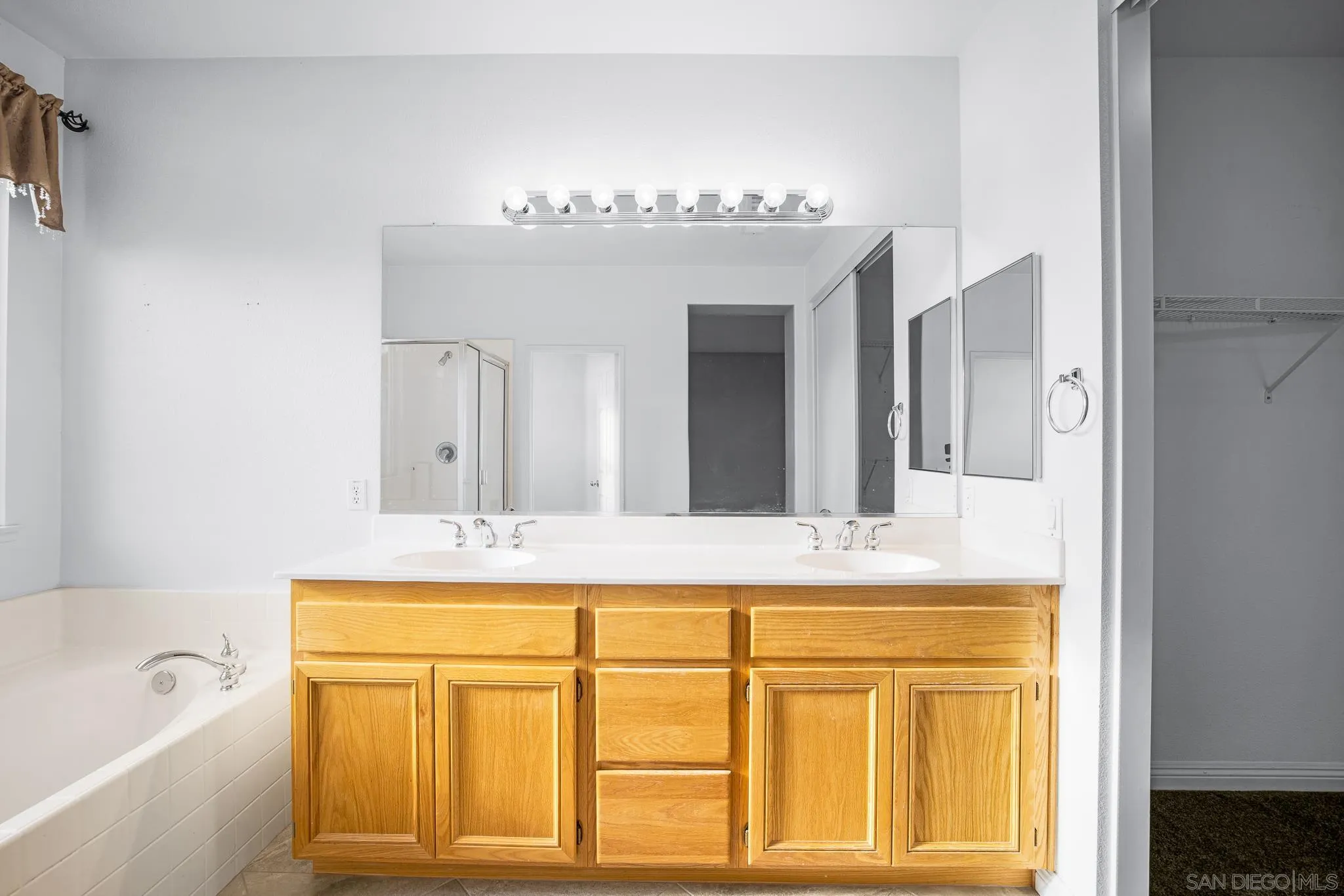 35511 Shadow Drive Winchester, CA 92596 - Photo 23 of 34 a bathroom with a sink vanity tub and a mirror