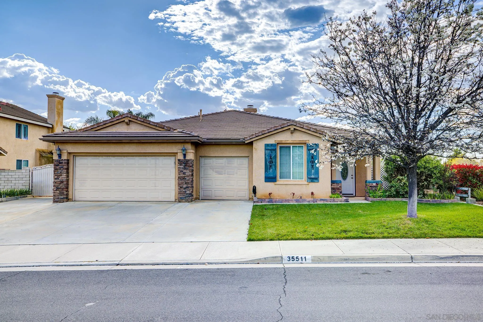 35511 Shadow Drive Winchester, CA 92596 - Photo 34 of 34 a front view of a house with a garden and trees