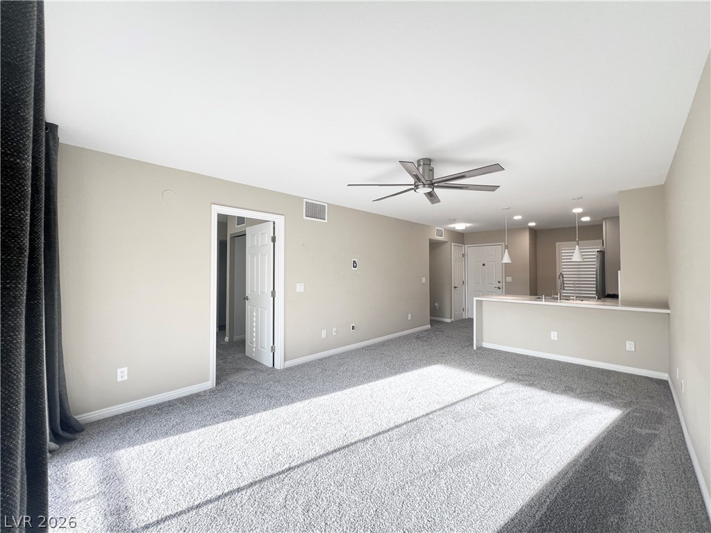 8070 West Russell Road, Unit 2070 Las Vegas, NV 89113 - Photo 2 of 25 Large size living room with ceiling fan with LED light and flat-panel TV Prewire