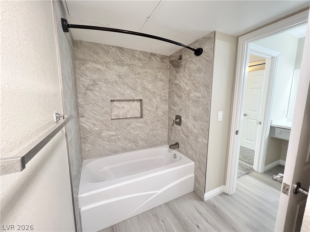 8070 West Russell Road, Unit 2070 Las Vegas, NV 89113 - Photo 8 of 25 Separate water closet with new tub and tile surrounds