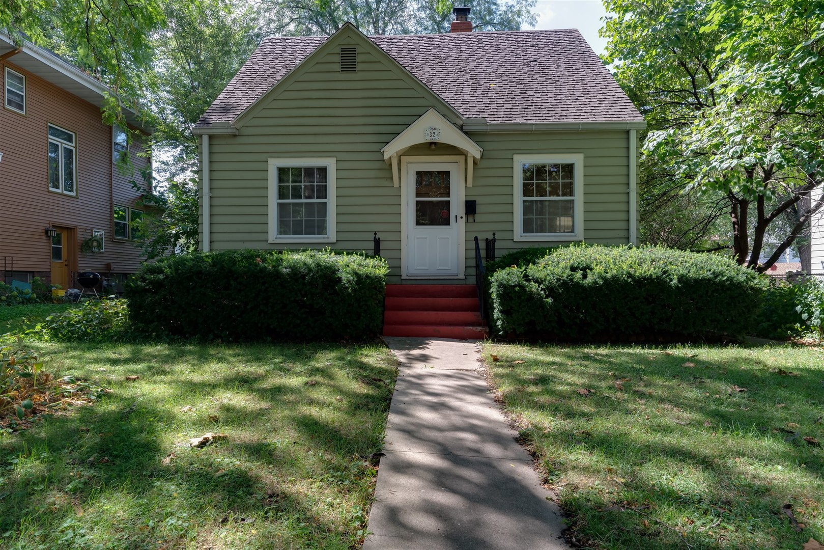 a view of a house with garden and plants