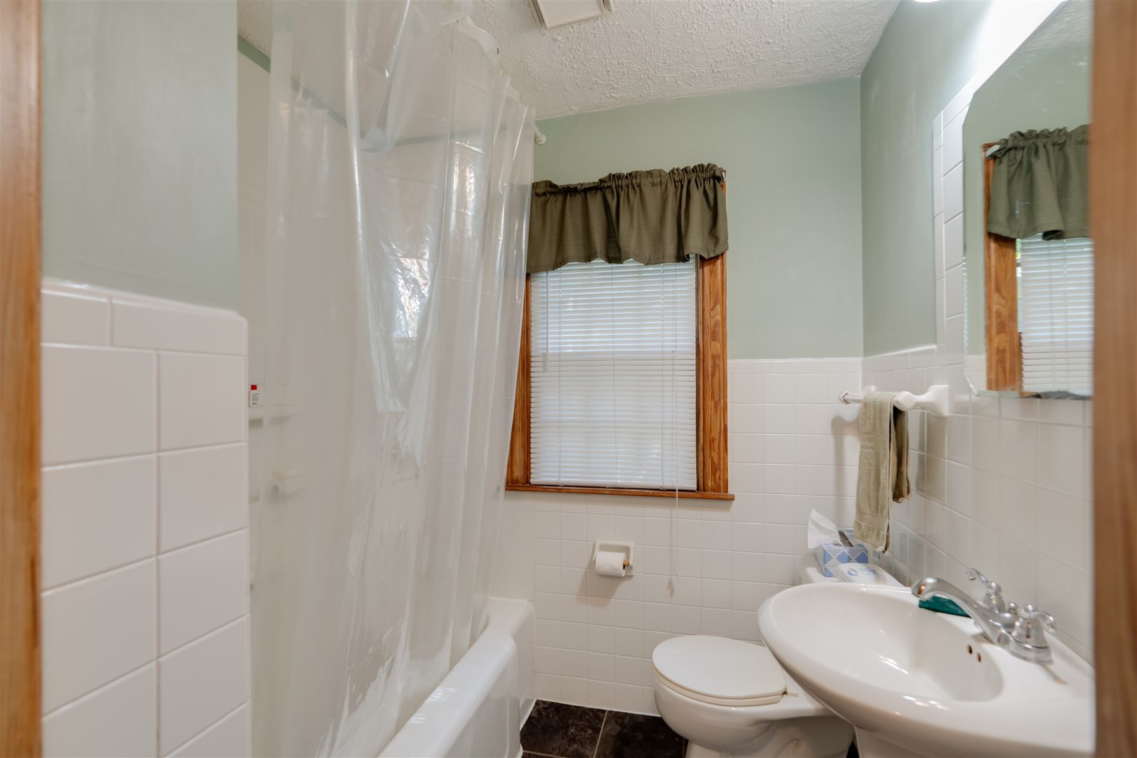32 White Place Bloomington, IL 61701 - Photo 13 of 26 a bathroom with a toilet sink and mirror
