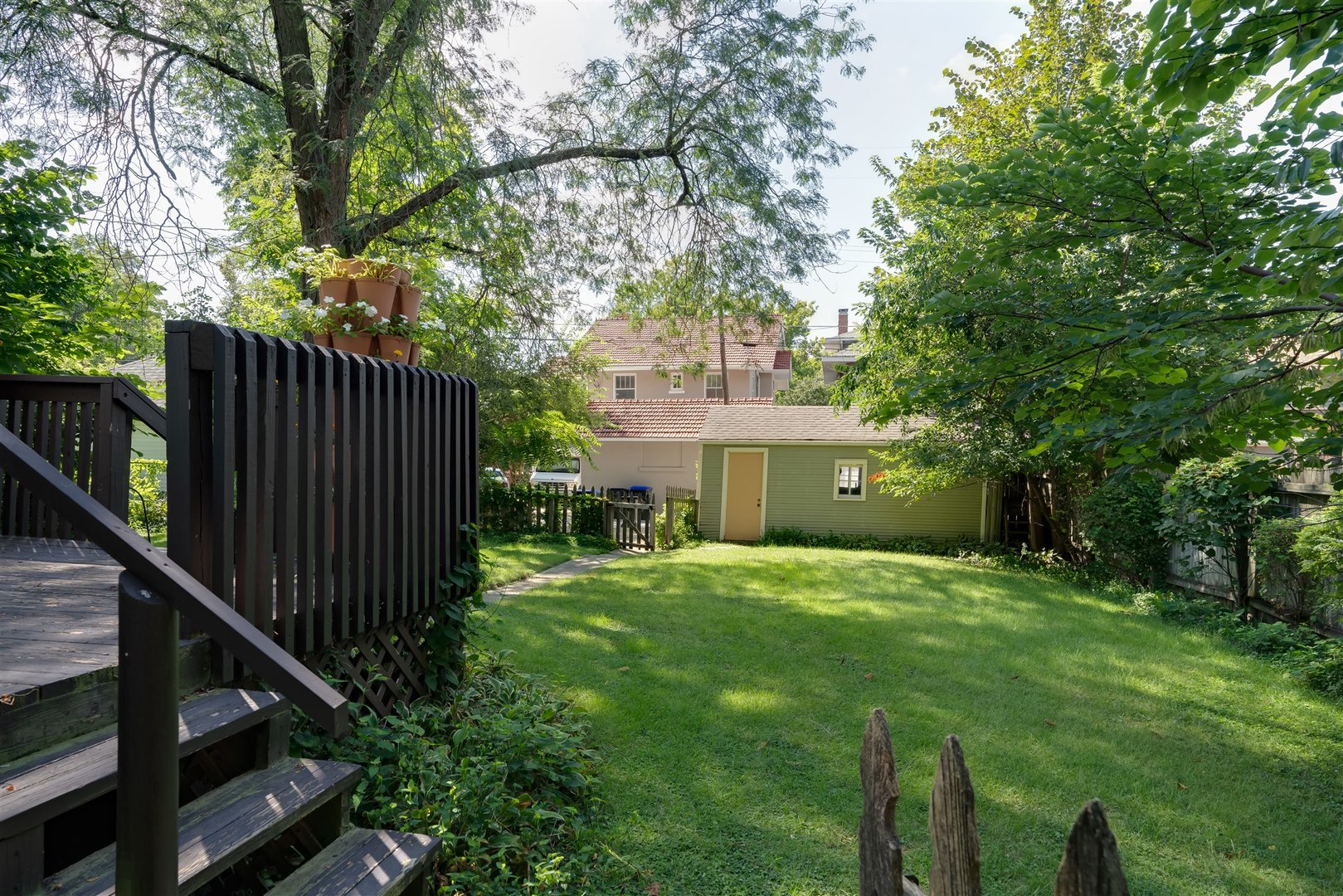 32 White Place Bloomington, IL 61701 - Photo 19 of 26 a view of a house with backyard and a tree