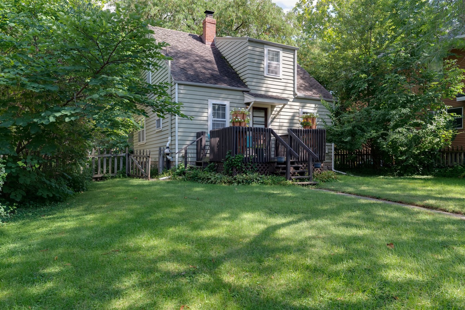32 White Place Bloomington, IL 61701 - Photo 25 of 26 a front view of a house with a garden and deck