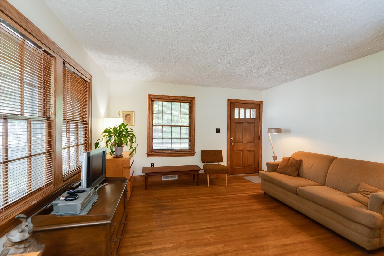 32 White Place Bloomington, IL 61701 - Photo 6 of 26 a living room with furniture flat screen tv and large windows